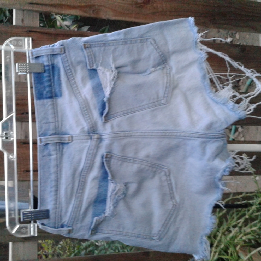 Woman's very distressed short brand is Abercrombie & Fitch high-rise size 28-6